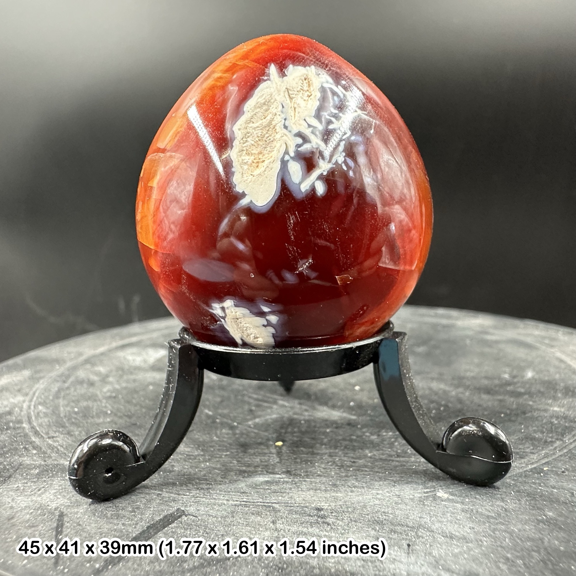Carnelian egg - brimming with warm hues that evoke the fiery beauty of a desert sunset